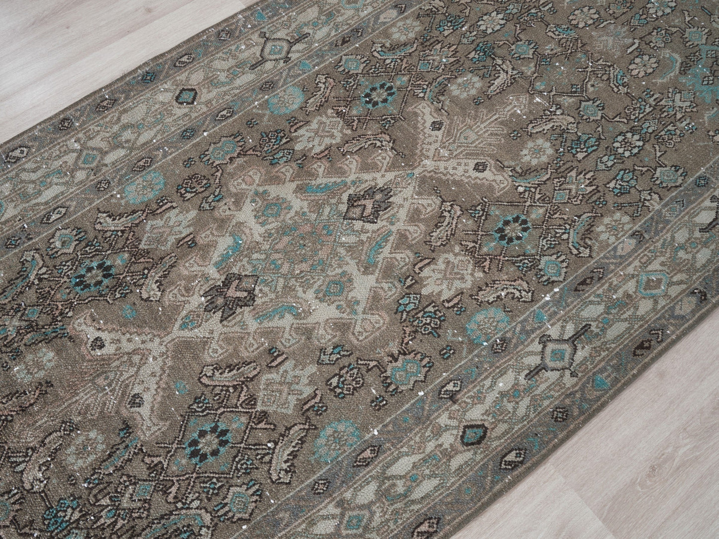  Infuse vintage elegance into your hallway! Our vintage Persian traditional runner rug boasts earthy tones, including browns, taupes, teal, and petrol blue, adorned with a tribal and Aztec diamond motif design. Hand-knotted and uniquely vintage, this antique rug adds timeless sophistication to your home, inspired by design styles reminiscent of Studio McGee and Amber Interiors.